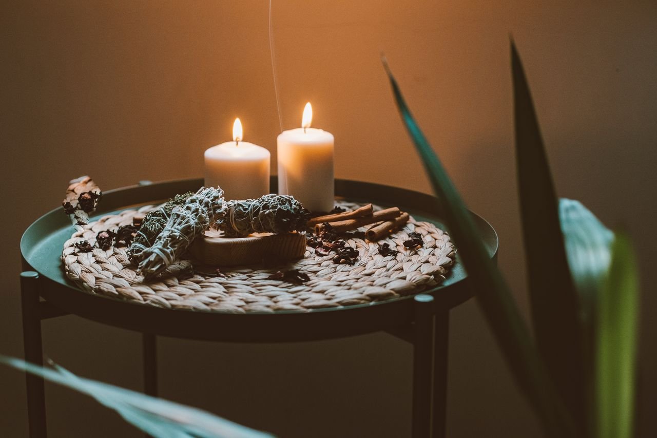 pexels photo 6205897 6205897 A serene candlelit setup featuring sage, cinnamon, and herbal elements. Perfect for relaxation and rituals.