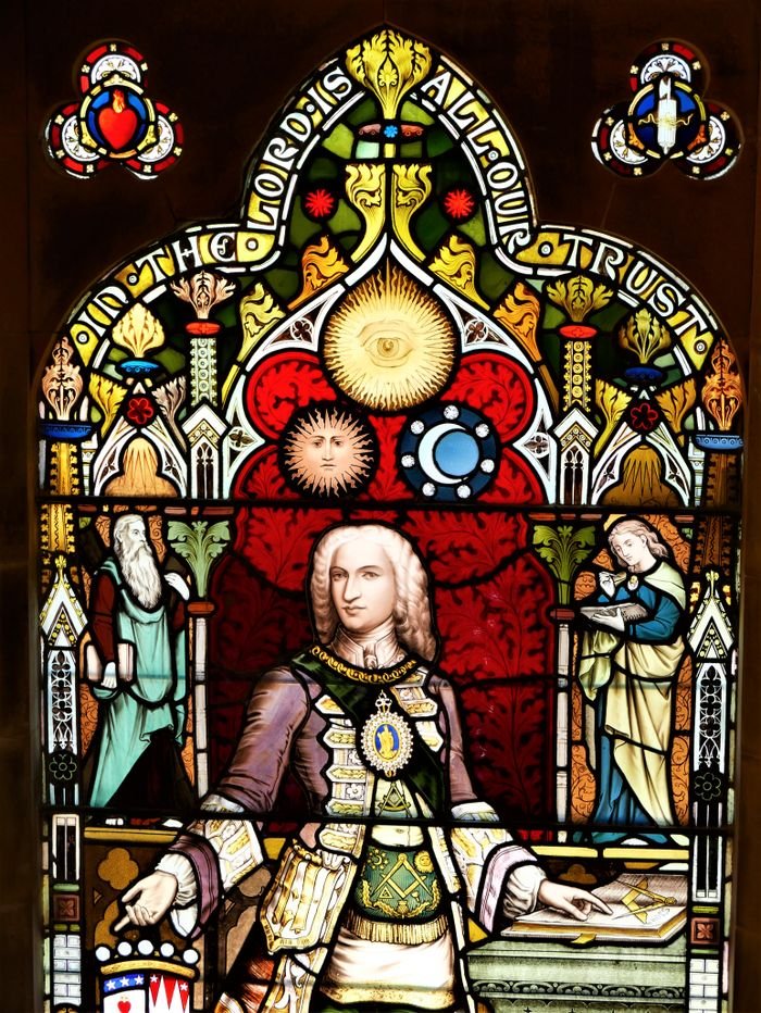 Detailed stained glass artwork featuring historical and religious elements in Lerwick, Scotland.